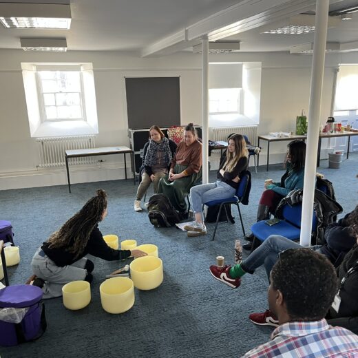 Philly Berridge demonstrating a sound bath at the Evolve Artist creative health meet up, Chatham
